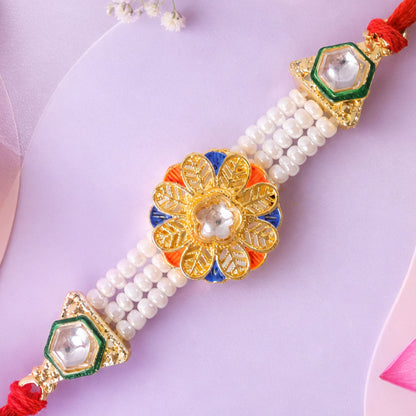 Pearl Flower Rakhi with Blue Yellow Details and Elegant Festive Brother Gift Styling
