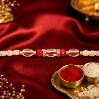 Peach Twisted Cord Rakhi with Red and Sparkling Crystal Bead Accents