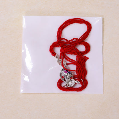 Silver-Toned Peacock Rakhi with Pink-Blue Enamel, Crystal Accents & Red Thread for Brother