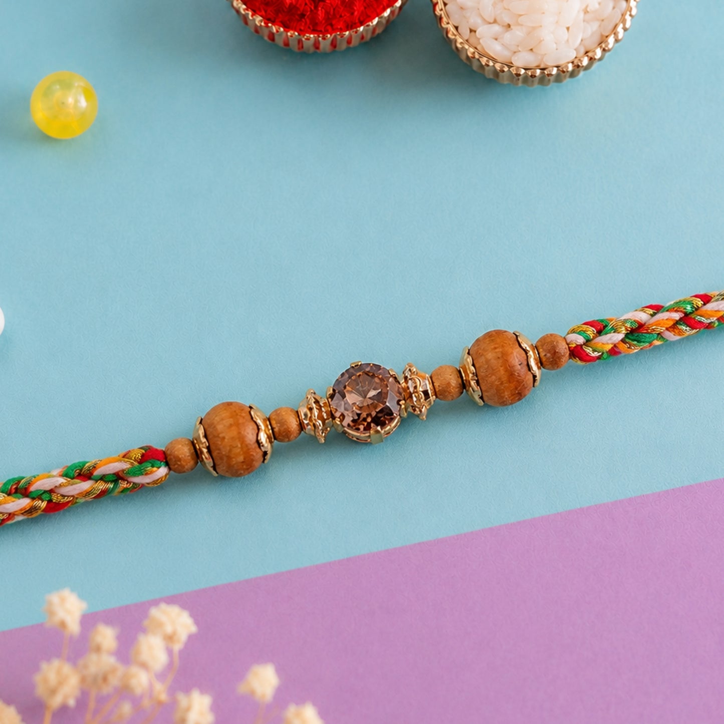Vibrant Stone Rakhi with Color Beads, Gold Accents and Festive Thread Beauty