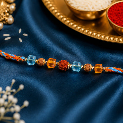 Blue Beaded Bracelet Rakhi with Golden Spacers and Colorful Festive Charm