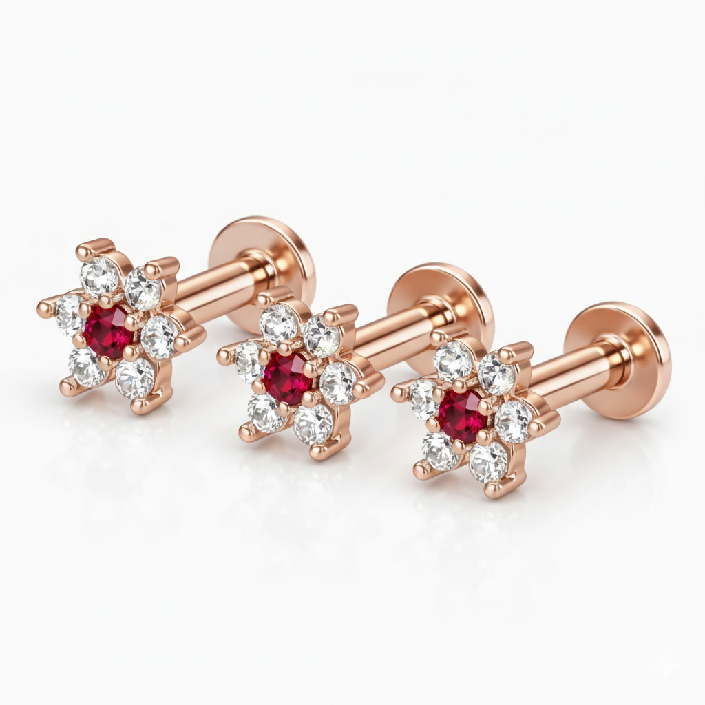 Set of three rose gold floral flat back stud earrings showcasing ruby and diamond design