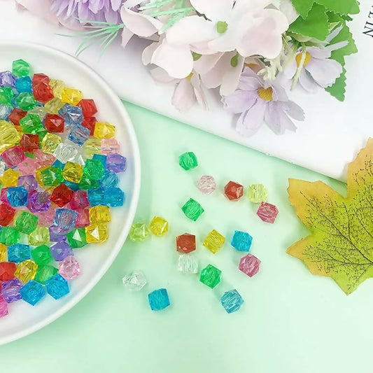 Multicolor acrylic crystal gems arranged in a heart shape for vase decoration
