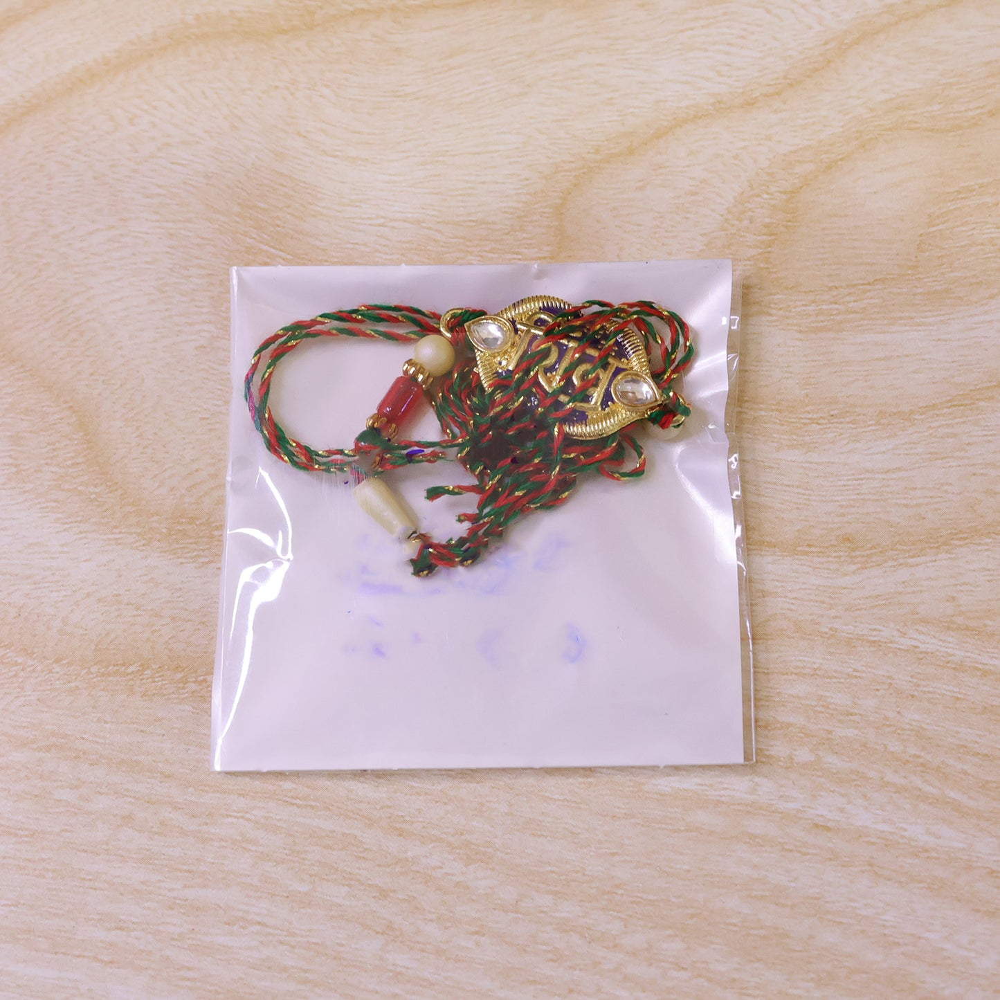 Shiv Text Pendant Rakhi with Purple Enamel and Kundan Stones