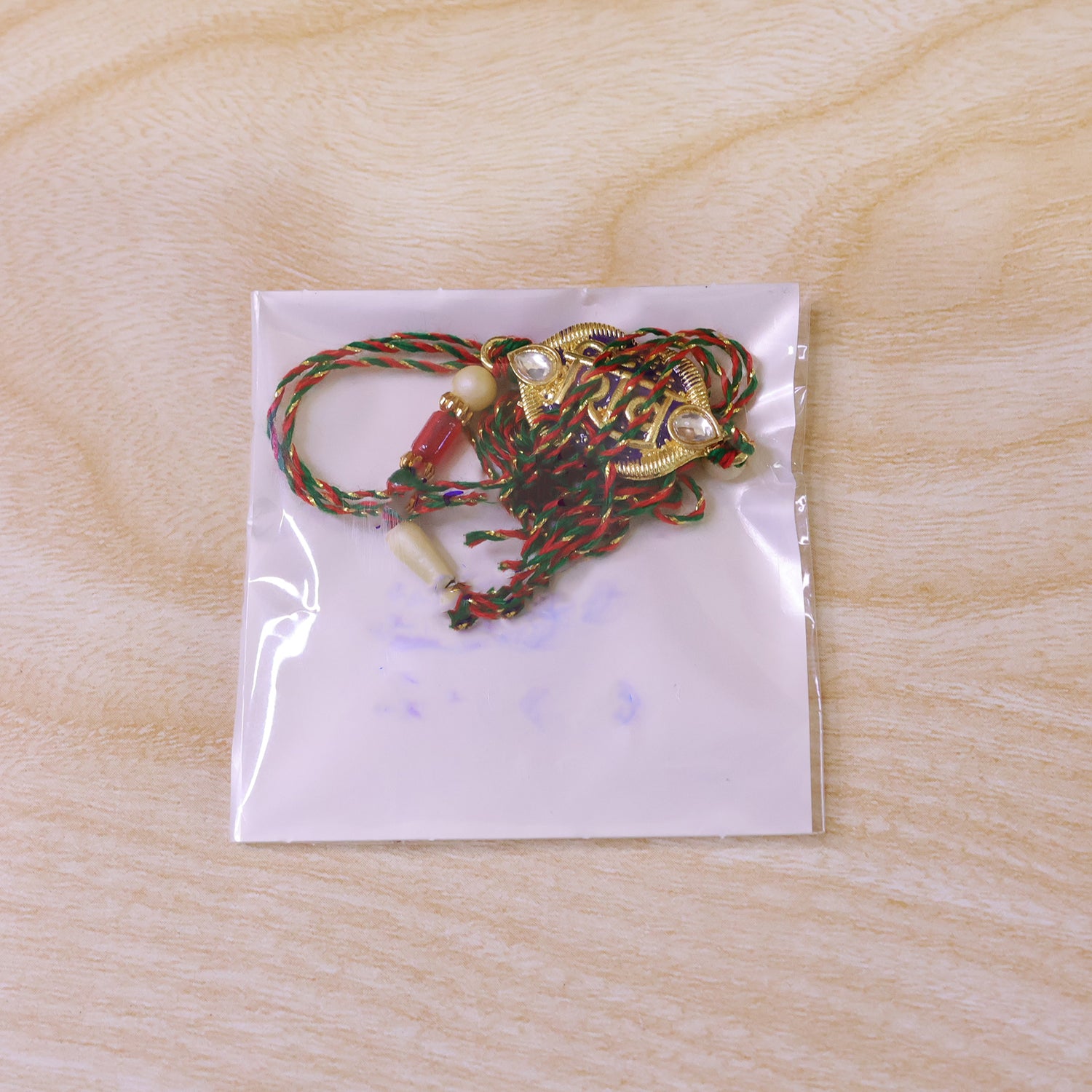 Shiv Text Pendant Rakhi with Purple Enamel and Kundan Stones
