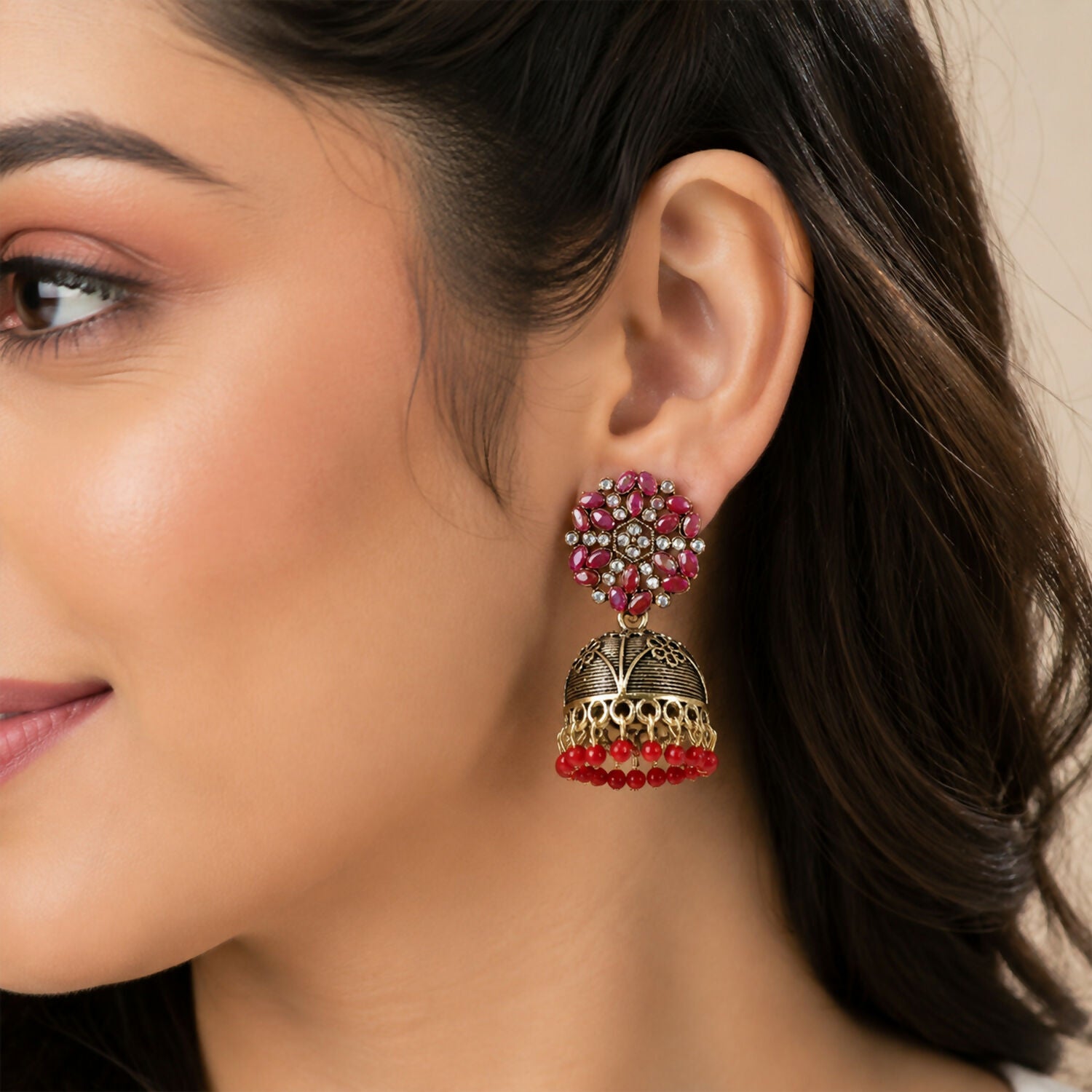 Side angle of antique jhumka earrings highlighting bead hangings