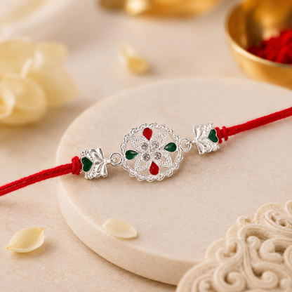 White Silver Floral Rakhi with Red Stone Center and Side Charms