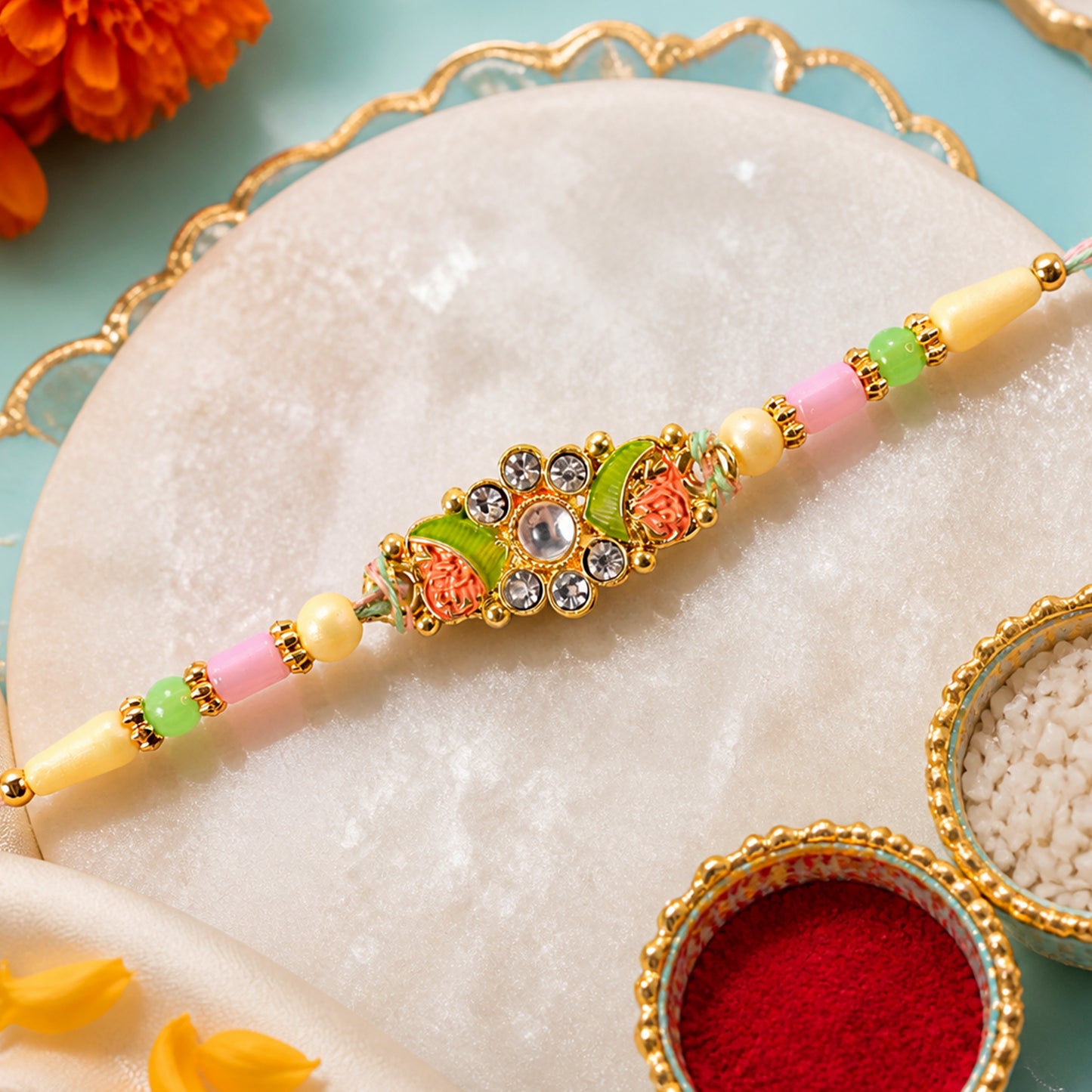 Ornate Rakhi featuring Floral Mirror Medallion, bead line and chain look for Gift Use