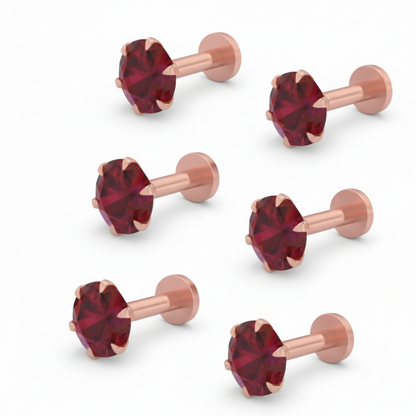 Detailed view of ruby nosepin stud featuring rose gold plating and lab-grown ruby