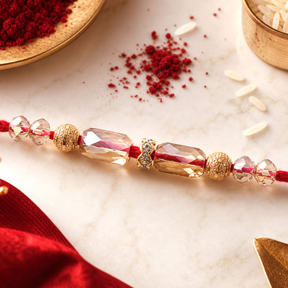 Red Thread Rakhi with Champagne Crystal Beads and Golden Accents
