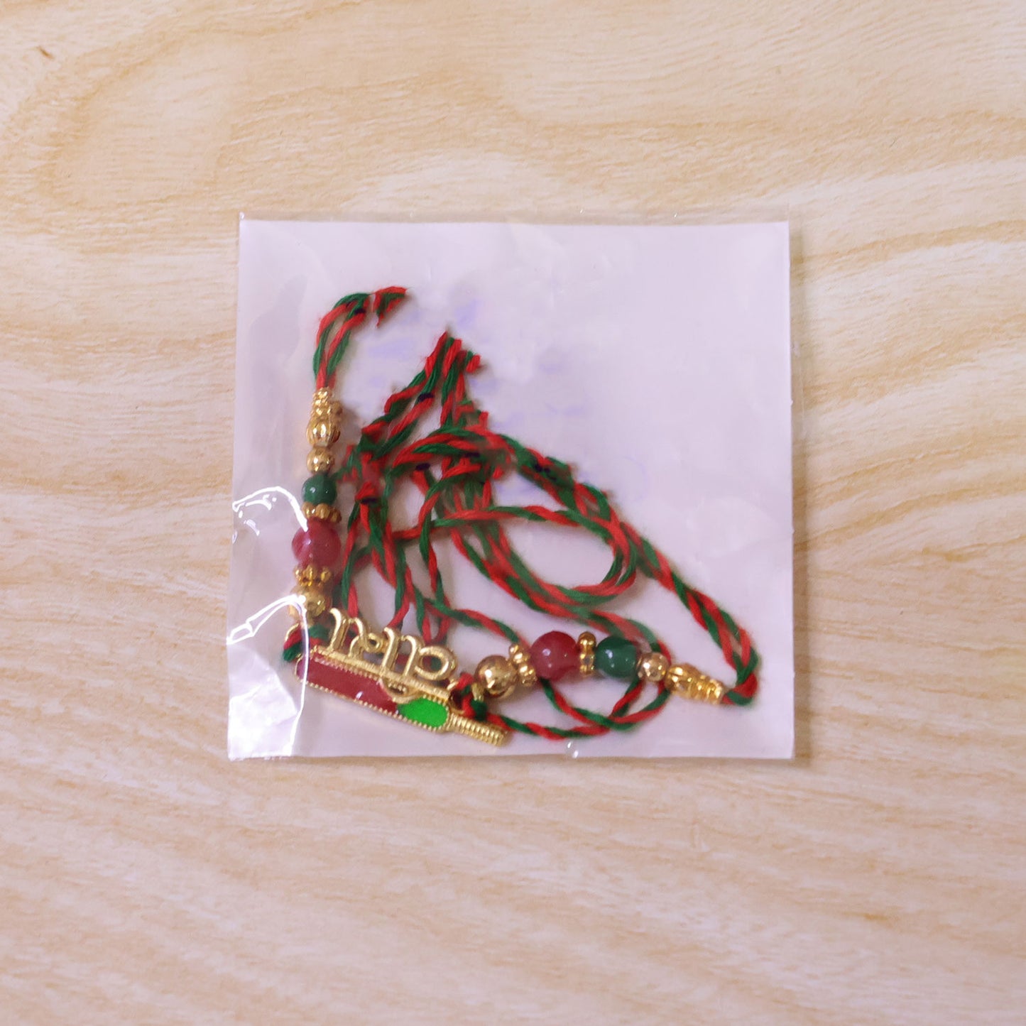 Premium Rakhi showcasing Bhai Text Plaque, clean frame and wrist look for Gift Use