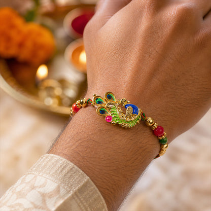 Green and Blue Peacock Enamel Pendant Rakhi with Red and Green Beads
