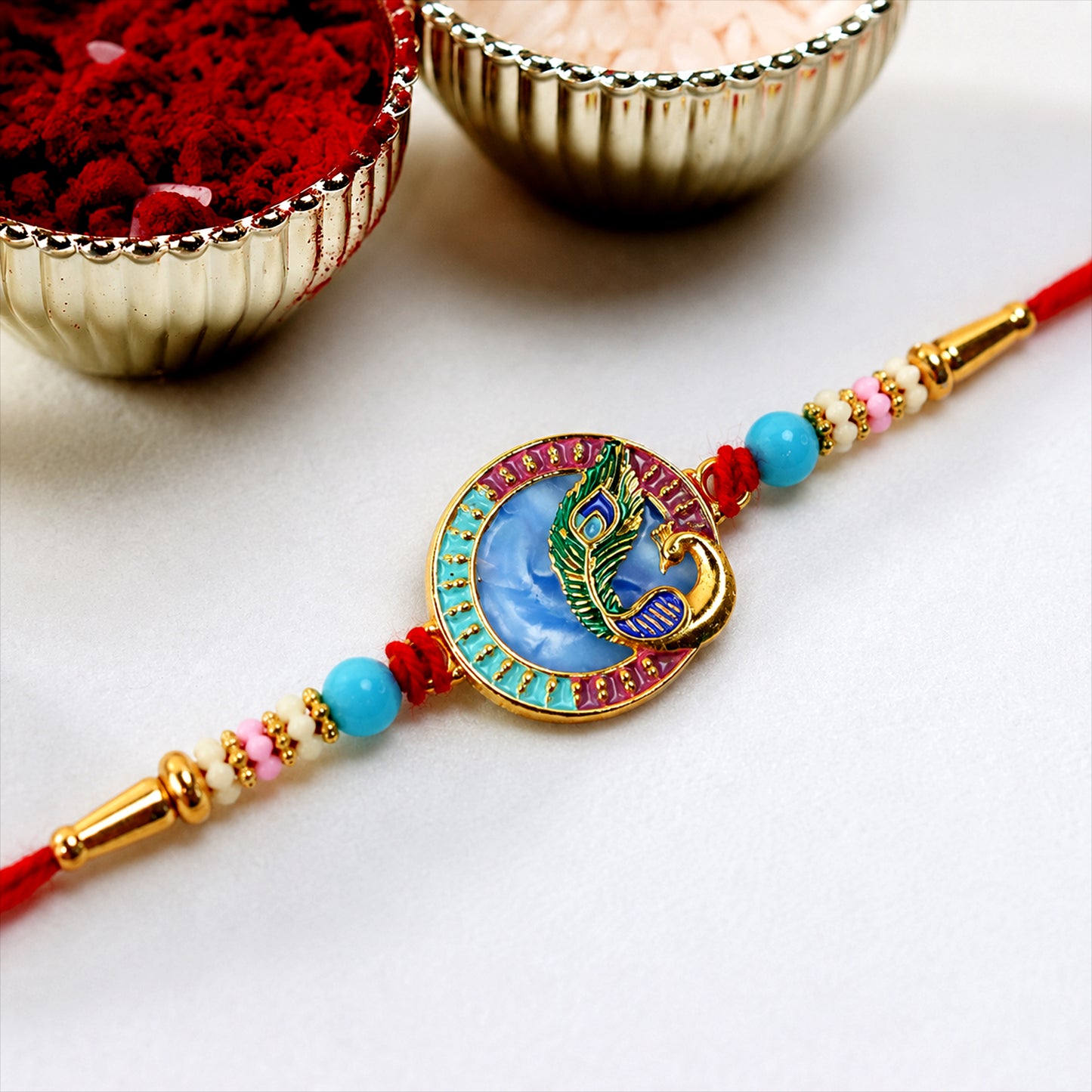 Festive Peacock Rakhi tied with soft thread and beads