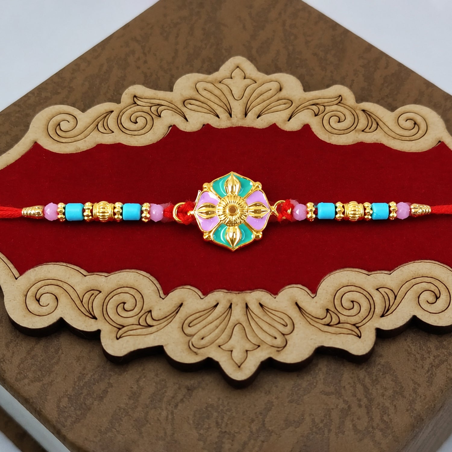 Flower motif rakhi with colorful beads close-up