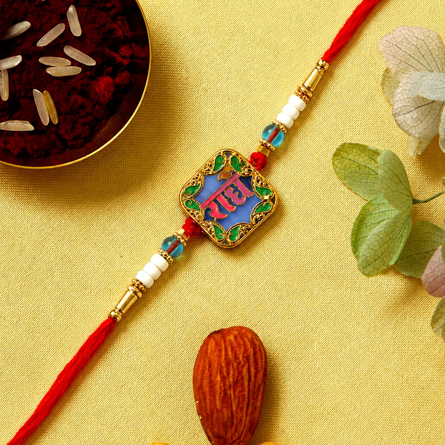Rakhi with Radhe engraved centerpiece and colorful beads
