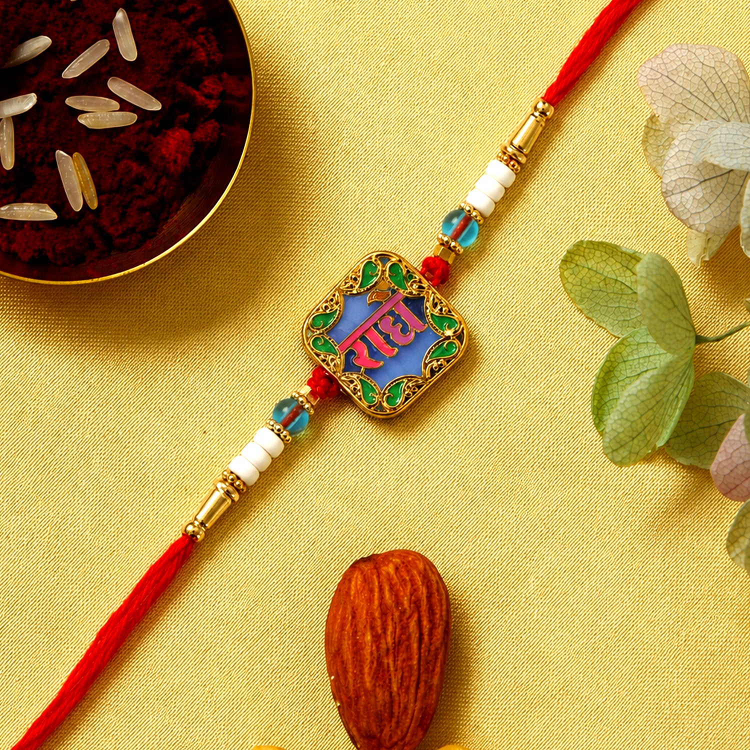 Rakhi with Radhe engraved centerpiece and colorful beads
