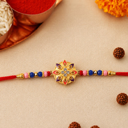 Floral Rakhi with decorative beads on white background
