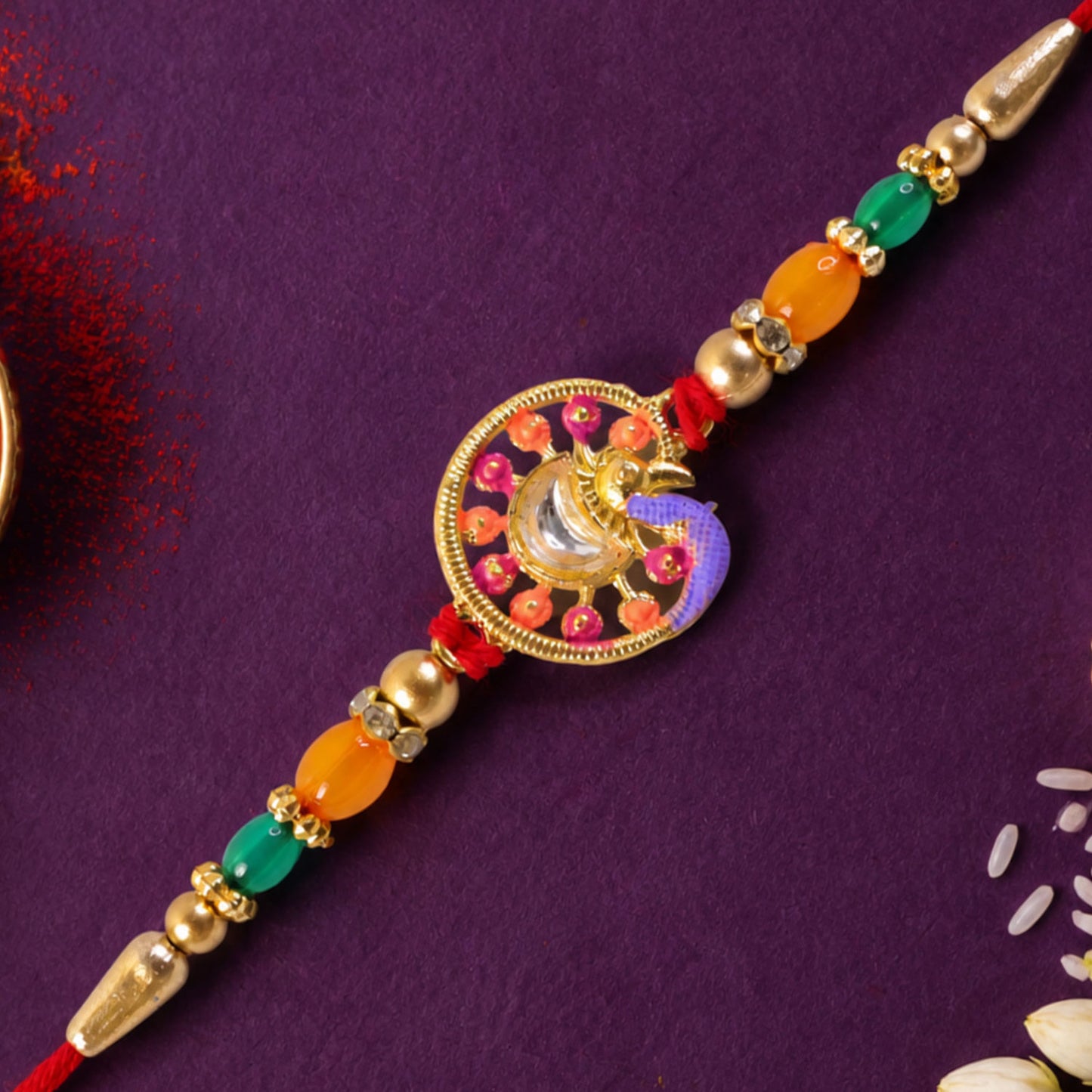 Traditional Rakhi with Round Sacred Medallion, gold trims and chain look for Gift Use
