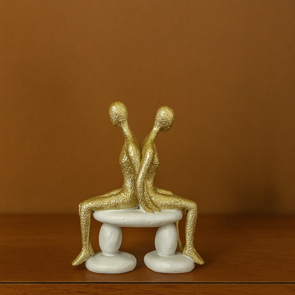 Abstract Golden Couple Sitting Figurine Showpiece for Home Decor & Gifting