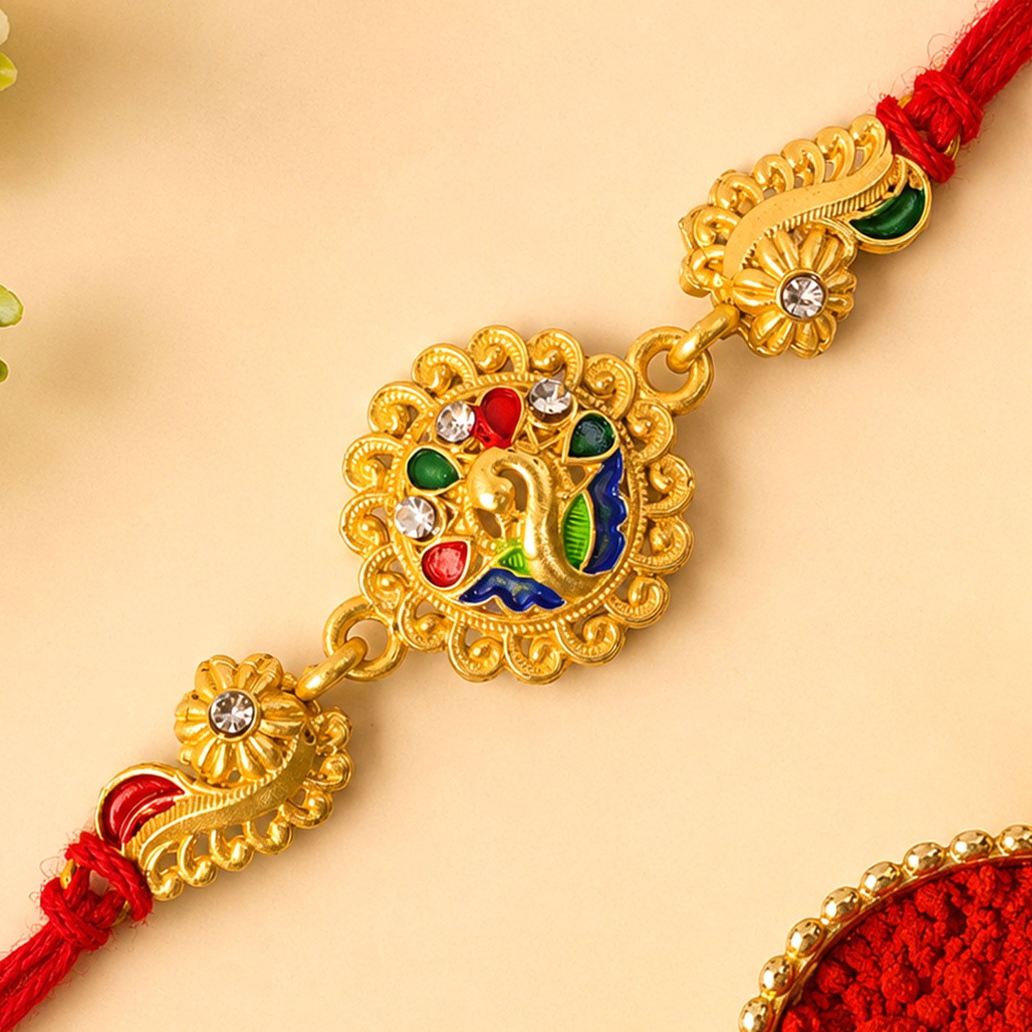 Graceful Rakhi with Floral Medallion, pink green stones and bead line for Gift Use