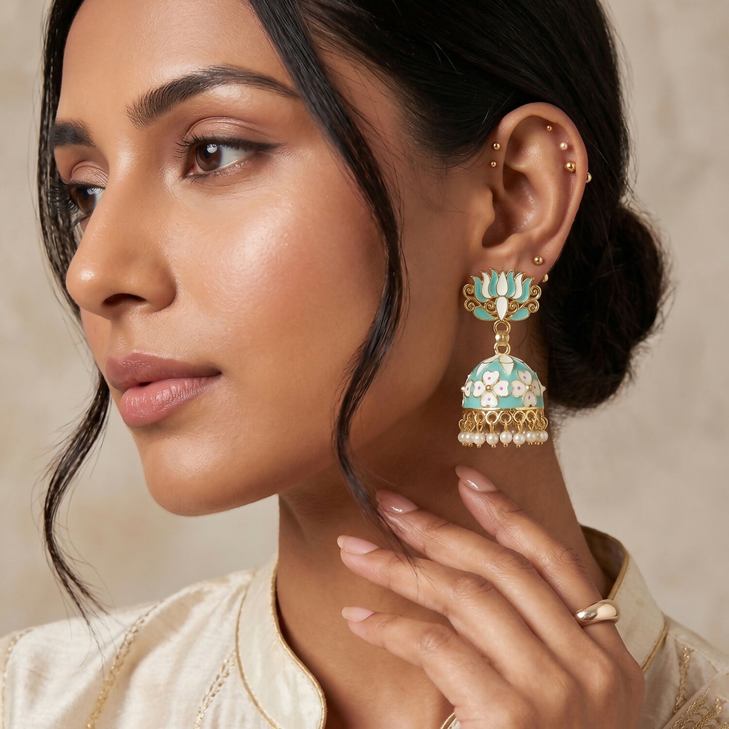 Side angle of Sea Pista Lotus Jhumka Earrings with pearls