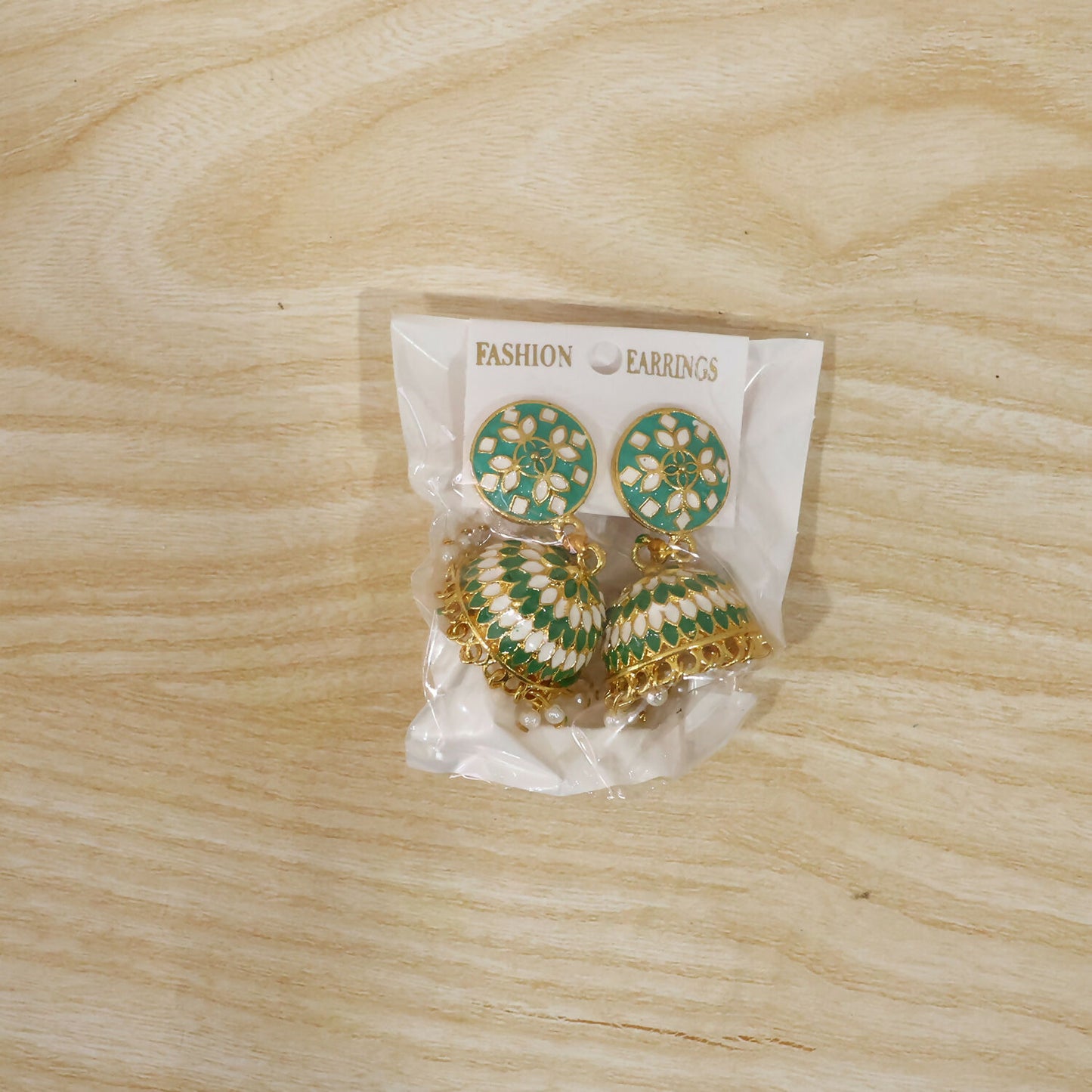 Green floral jhumka earrings worn with ethnic outfit