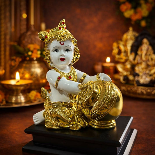 Bal Krishna idol with golden butter pot on decorative base