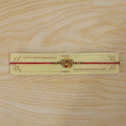 Traditional Shivling Rudraksha Rakhi with Red & Green Beads