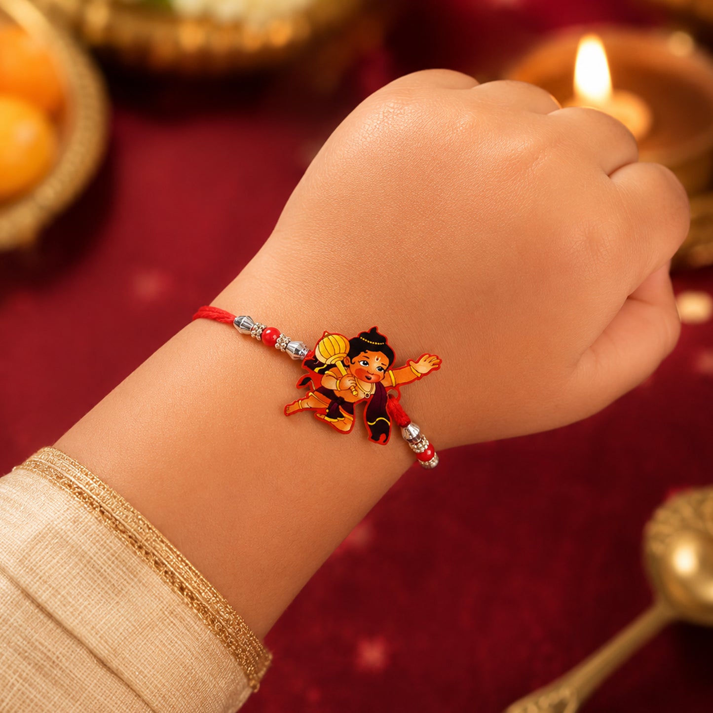 Little Hanuman Rakhi with Red Thread and Silver Bead Chain