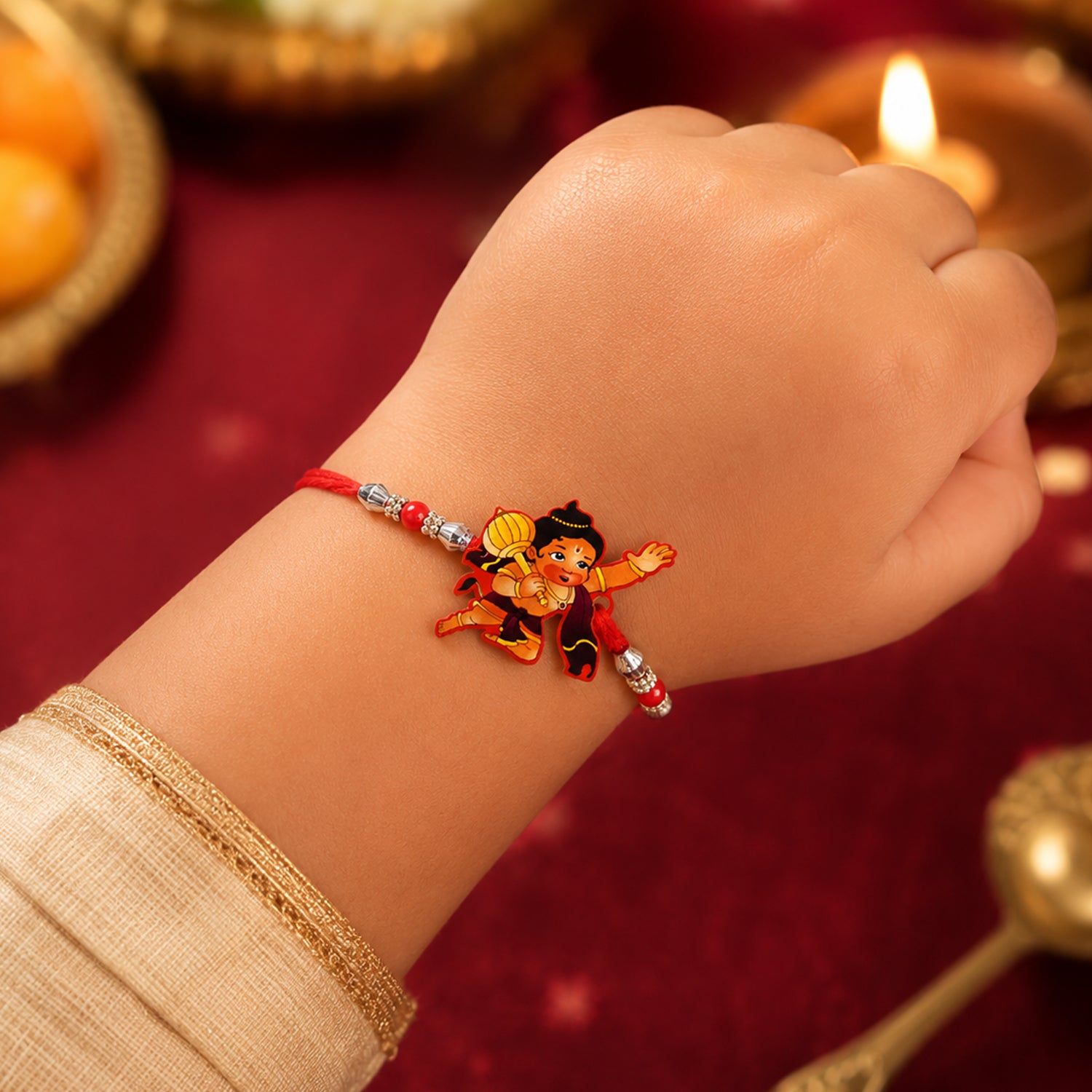 Little Hanuman Rakhi with Red Thread and Silver Bead Chain
