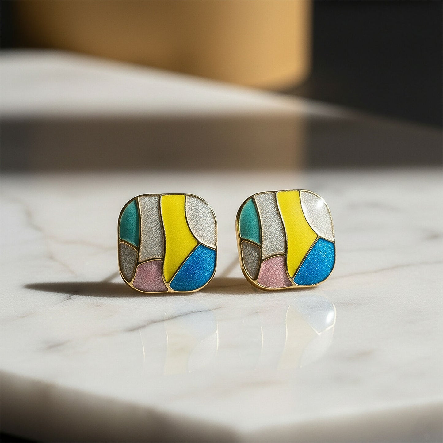 Side angle of stylish golden border enamel stud earrings