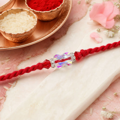 Red Thread Rakhi with an Iridescent Bow-Tie Shaped Crystal Bead