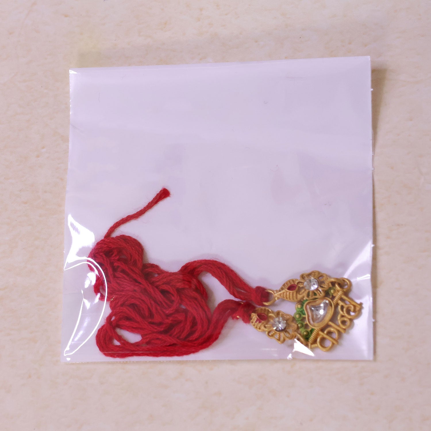 Elegant Rakhi showcasing Personalized Name Script, gold trims and wrist look for Gift