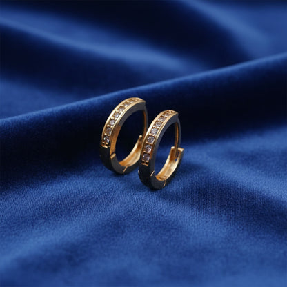 Close-up of sparkling crystal-studded gold finish hoop earrings for women and girls