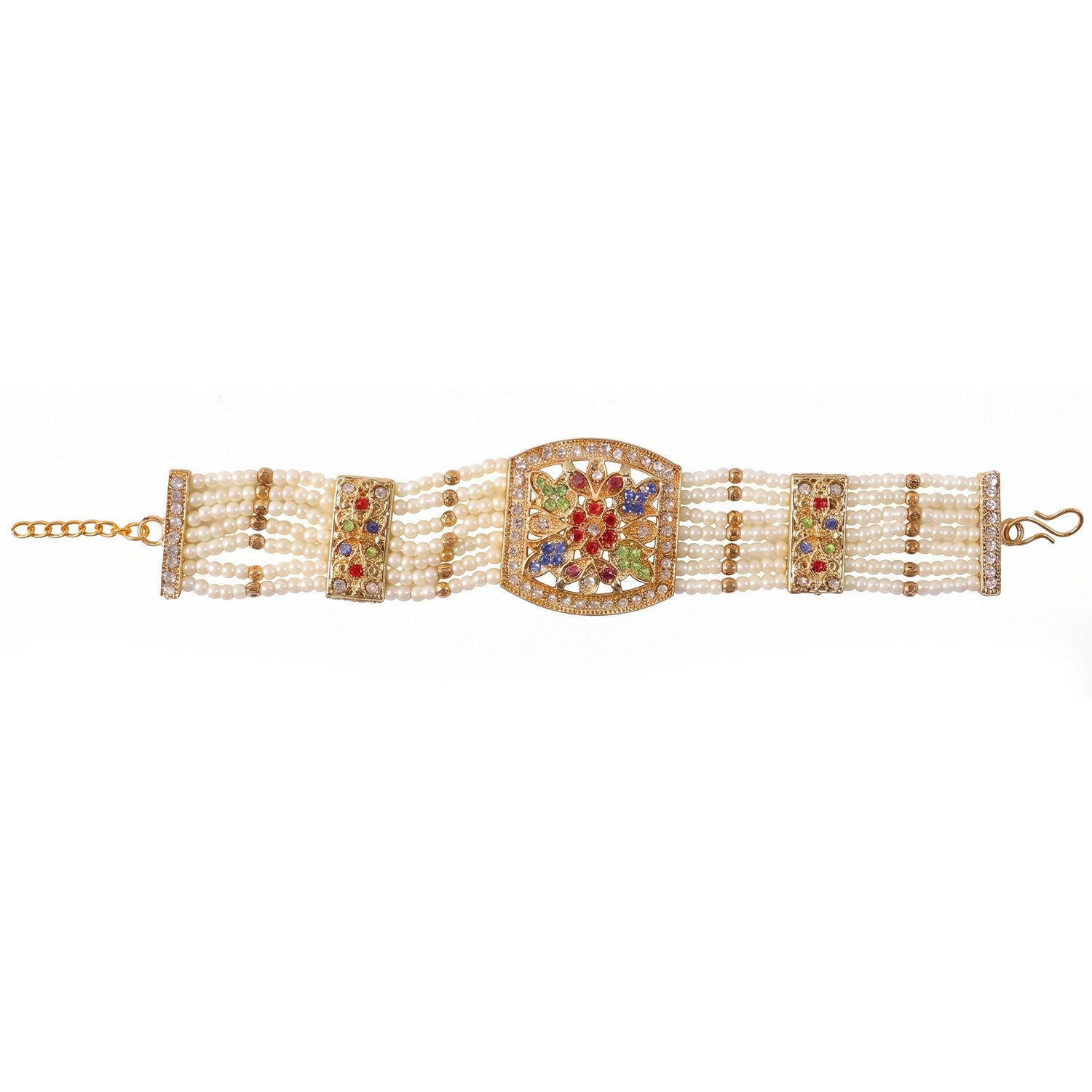 Side view of gold and pearl bracelet with stones