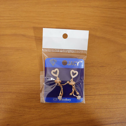 Rose gold romantic dangle earrings displaying fine dome accent and tassel tips