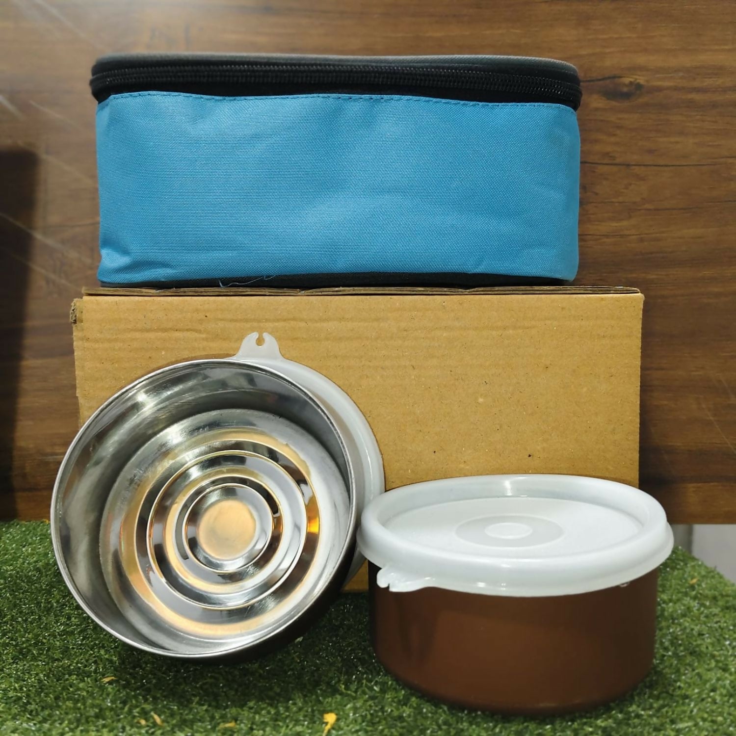 Portable stainless steel lunch box with zipper closure, ideal for travel