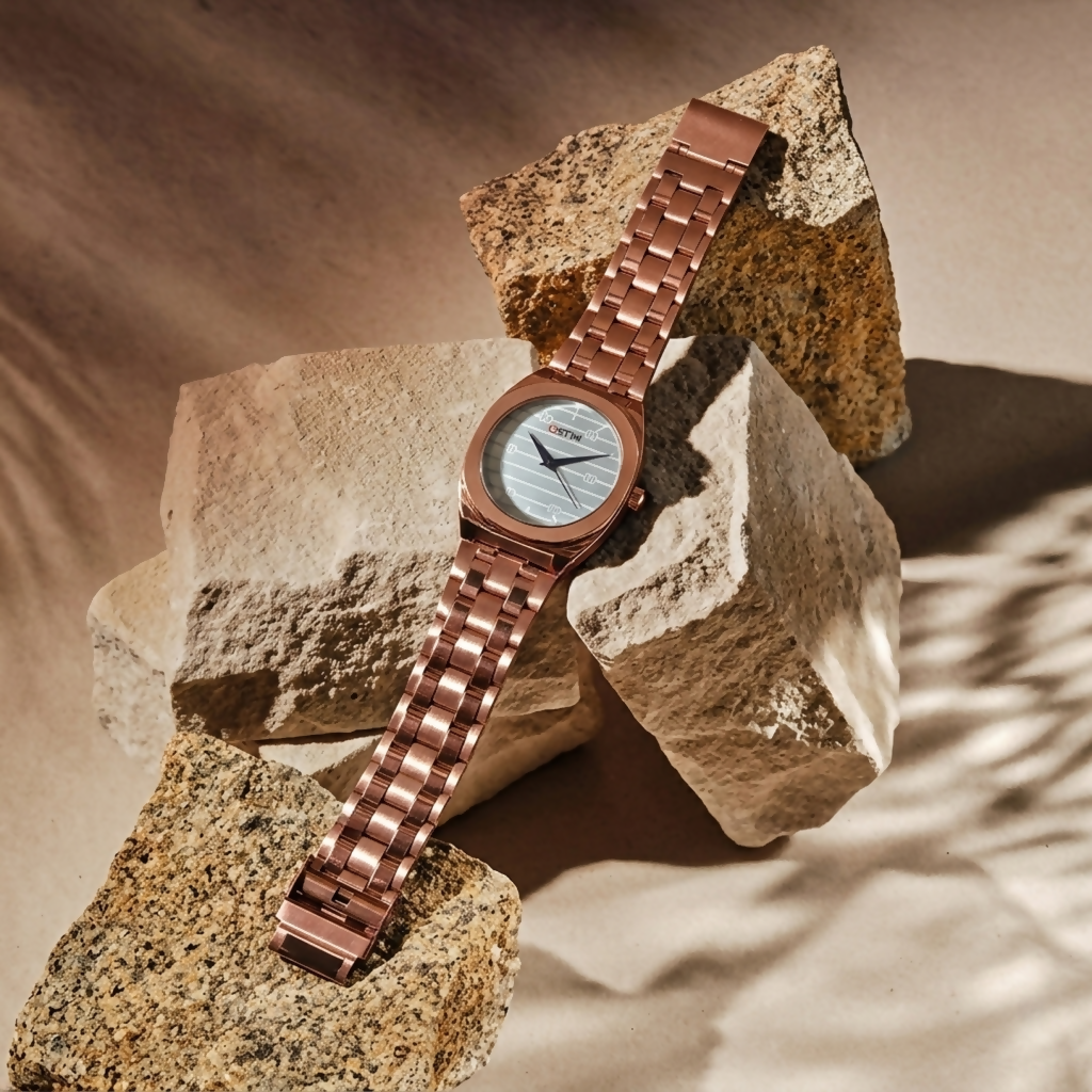 Stylish men's analog wrist watch with rose gold finish and clear markers