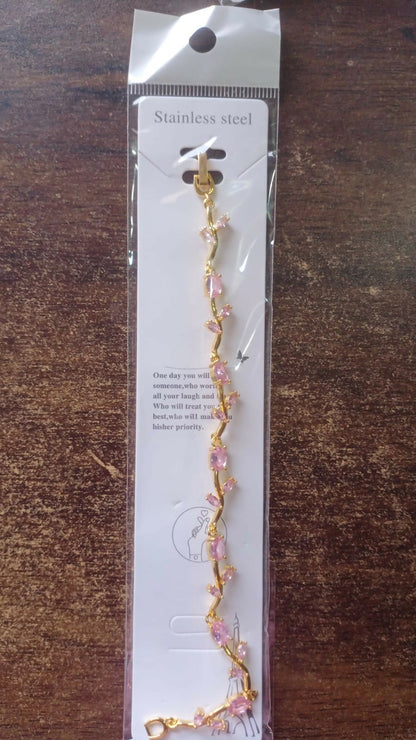 Model wearing gold-plated tulip vine bracelet