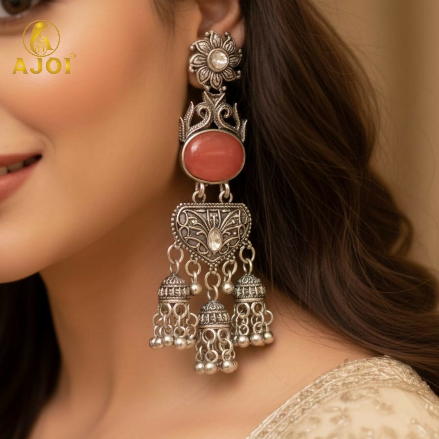 Vintage-Inspired Oxidized Silver Red Stone Jhumka Earrings with Ornate Filigree Design and Cascading Bell Danglers