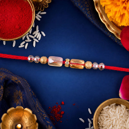 Red Thread Rakhi with Champagne Crystal Beads and Golden Accents