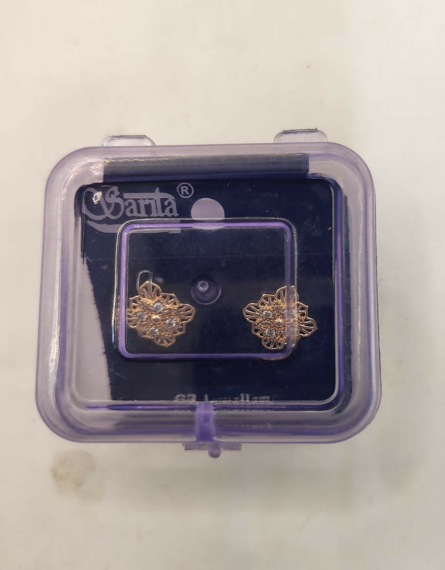 Rose gold filigree stud earrings worn as everyday elegant jewelry