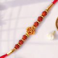 Om Bead Rakhi with Red Brown Accents and Spiritual Festive Brother Gift Styling Ideas