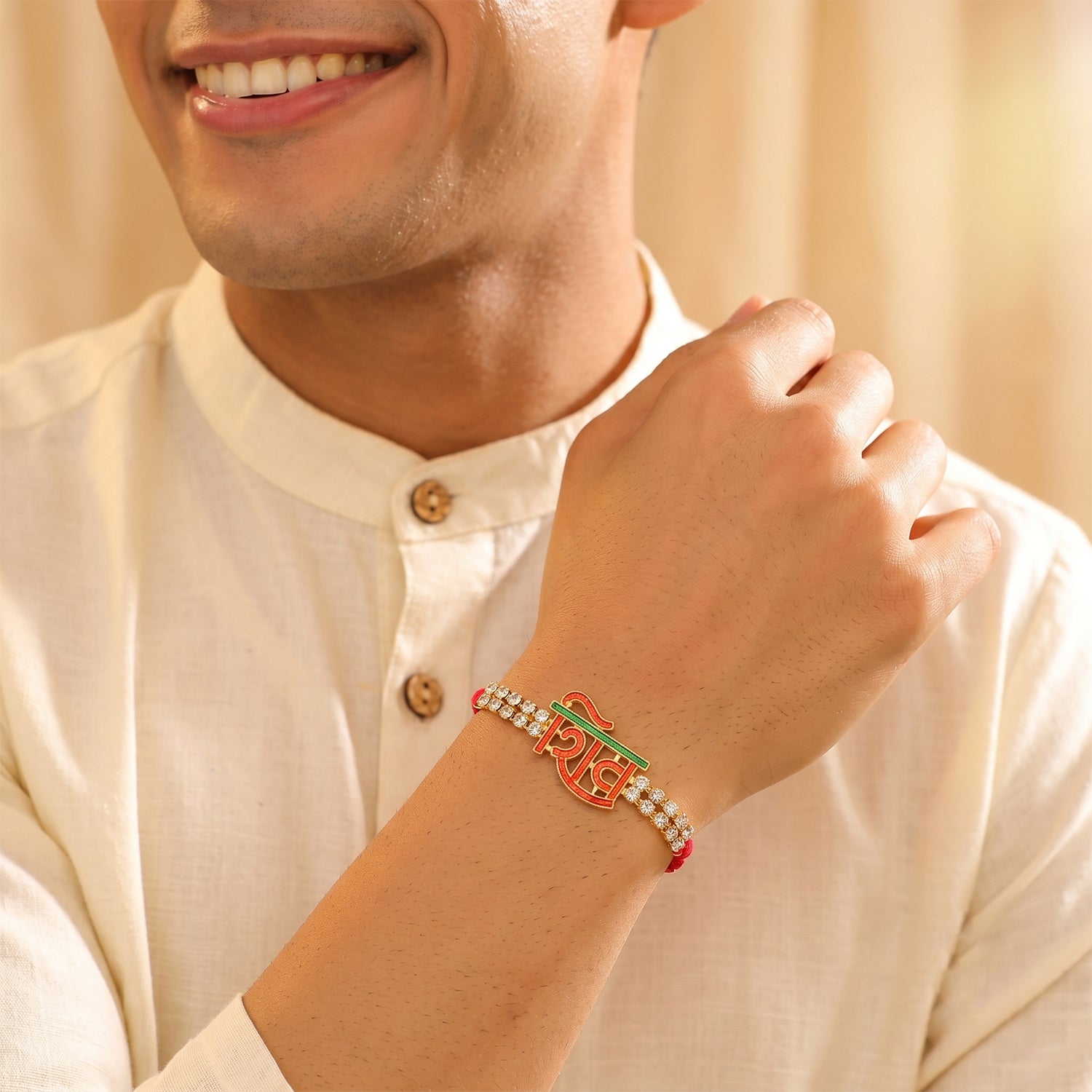 Shiv Letter Rakhi with Crystal Row and Red Mauli Thread
