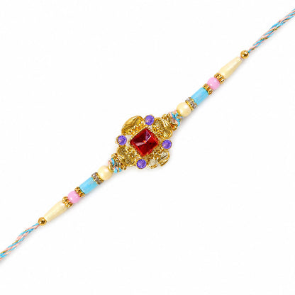 Ornate Rakhi showcasing Square Crystal Charm, gift finish and chain look for Gift Use