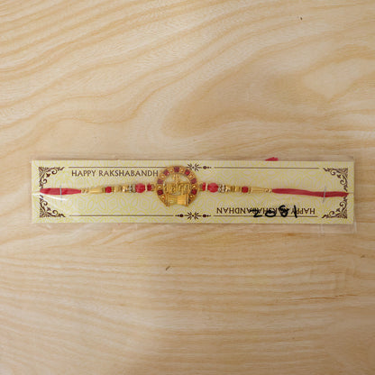 Mahadev Trishul Damru Round Rakhi with Red Pearls and Premium Center