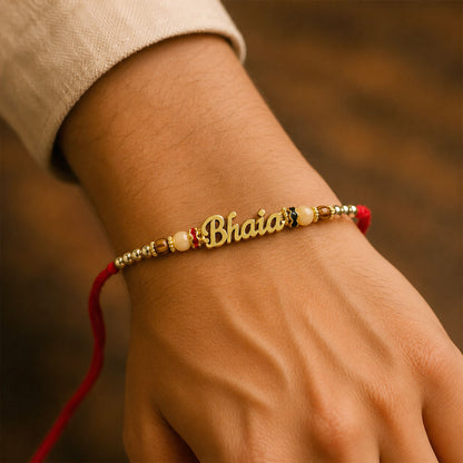 Bhaiya Name Golden Rakhi with Peach Brown Beads, Red Thread and Festive Shine