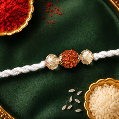 White Thread Rakhi with Rudraksha Bead and Sparkling Crystal Accents
