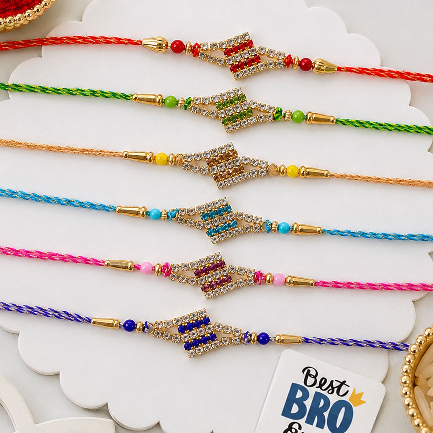 Layered Diamond Motif Rakhi in Mix Colour Threads (Pack of 6)