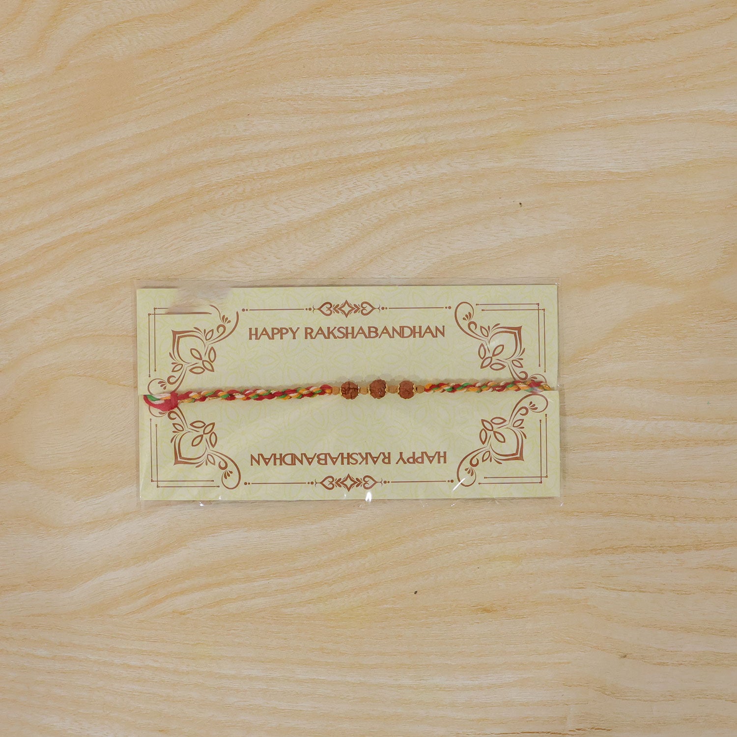 Rudraksha Style Devotional Rakhi with Braided Red Green Yellow Thread and Wooden Beads